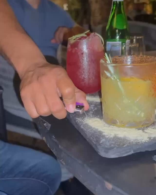 Two cocktails being served